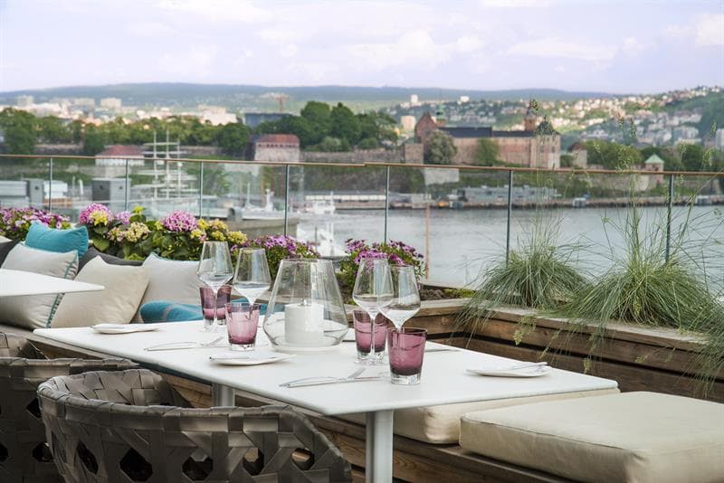 rooftop seating with views of the fjord and akerhus fortress